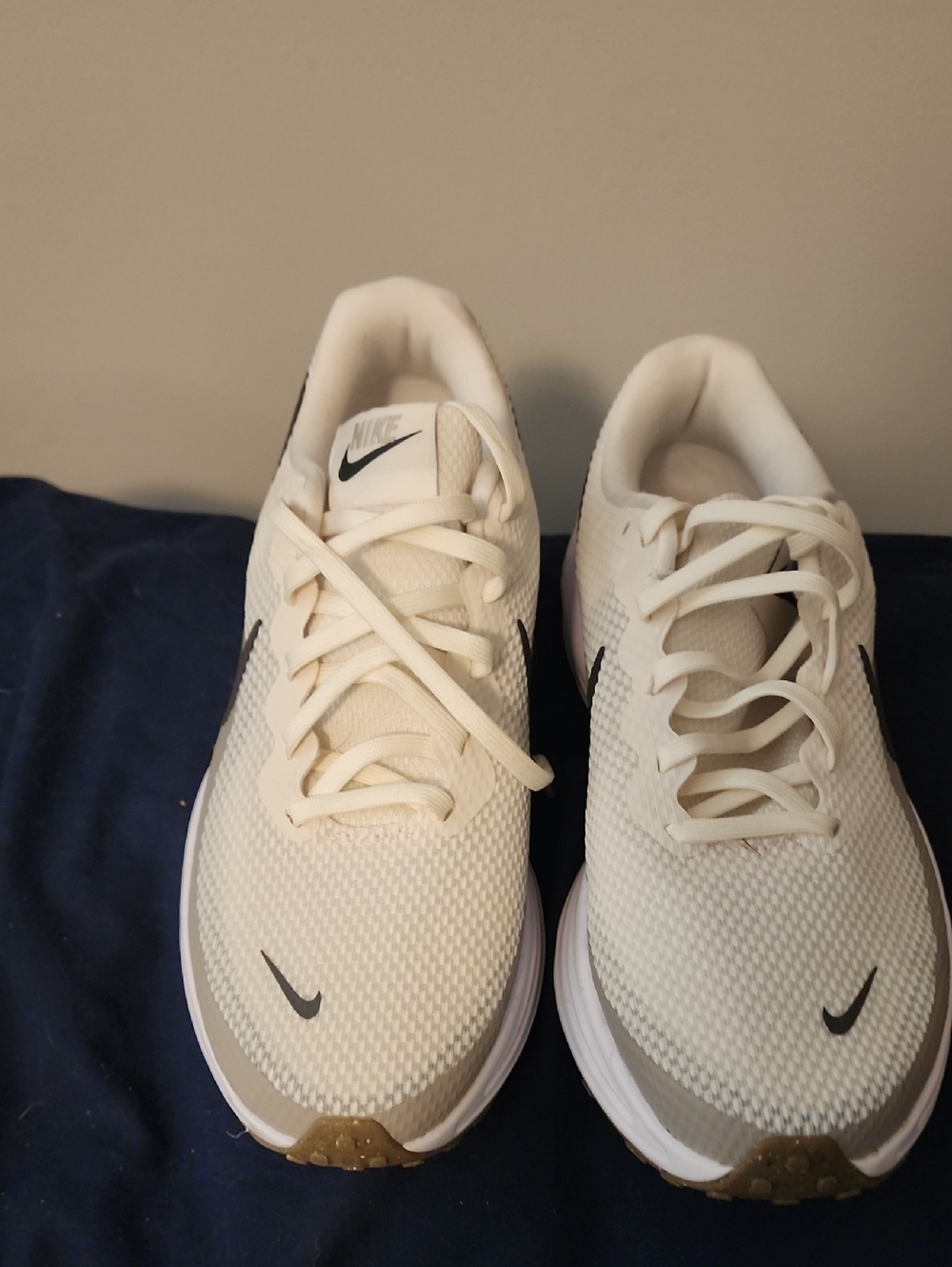 Nike Men's Cream/White Athletic Running Shoes with Black Swoosh